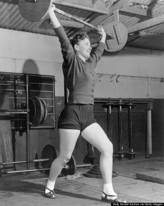 Woman lifting weights, 29 February 1956.